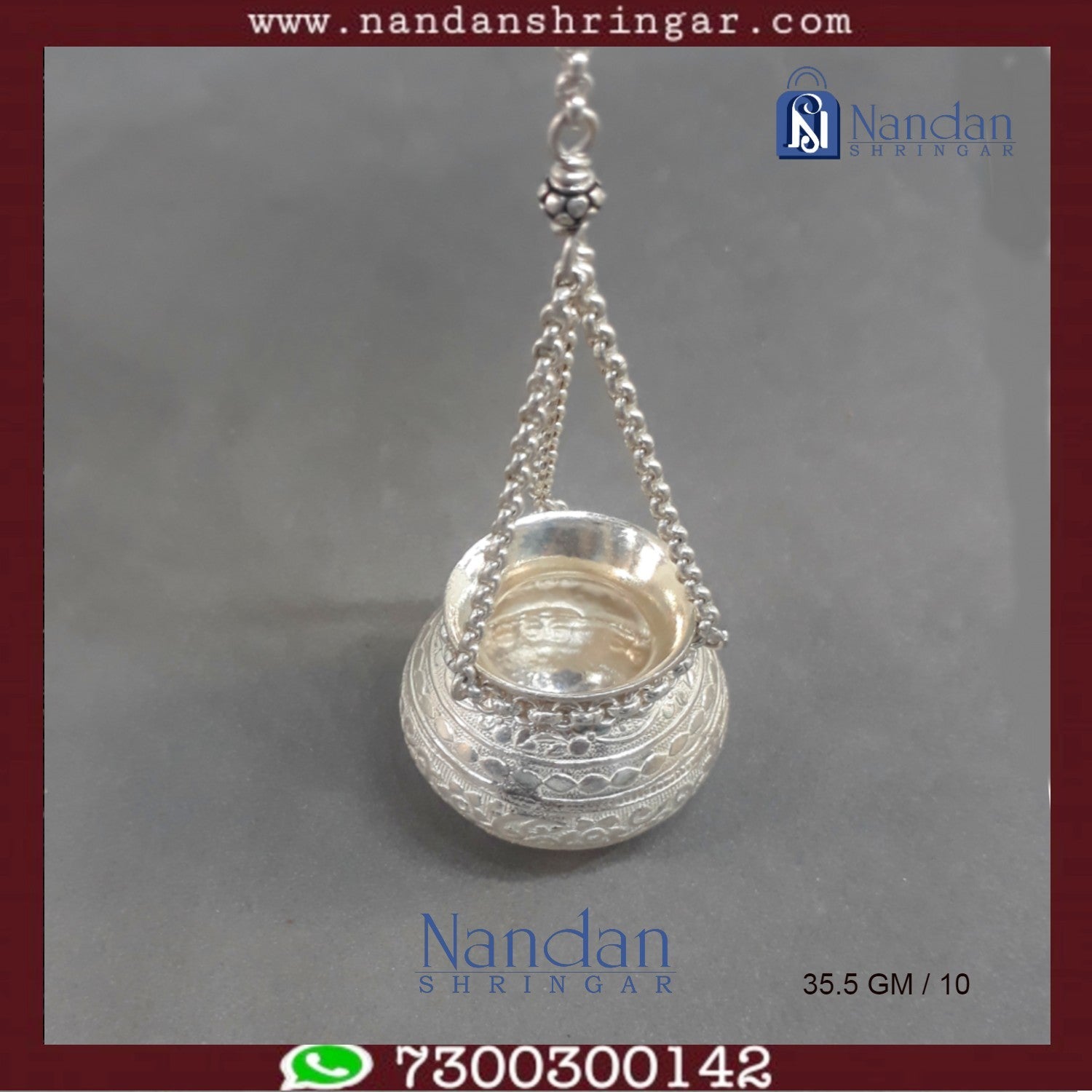 Fine silver hanging handi by Utsav Arts, featuring intricate designs and a polished finish, displayed against a neutral background.