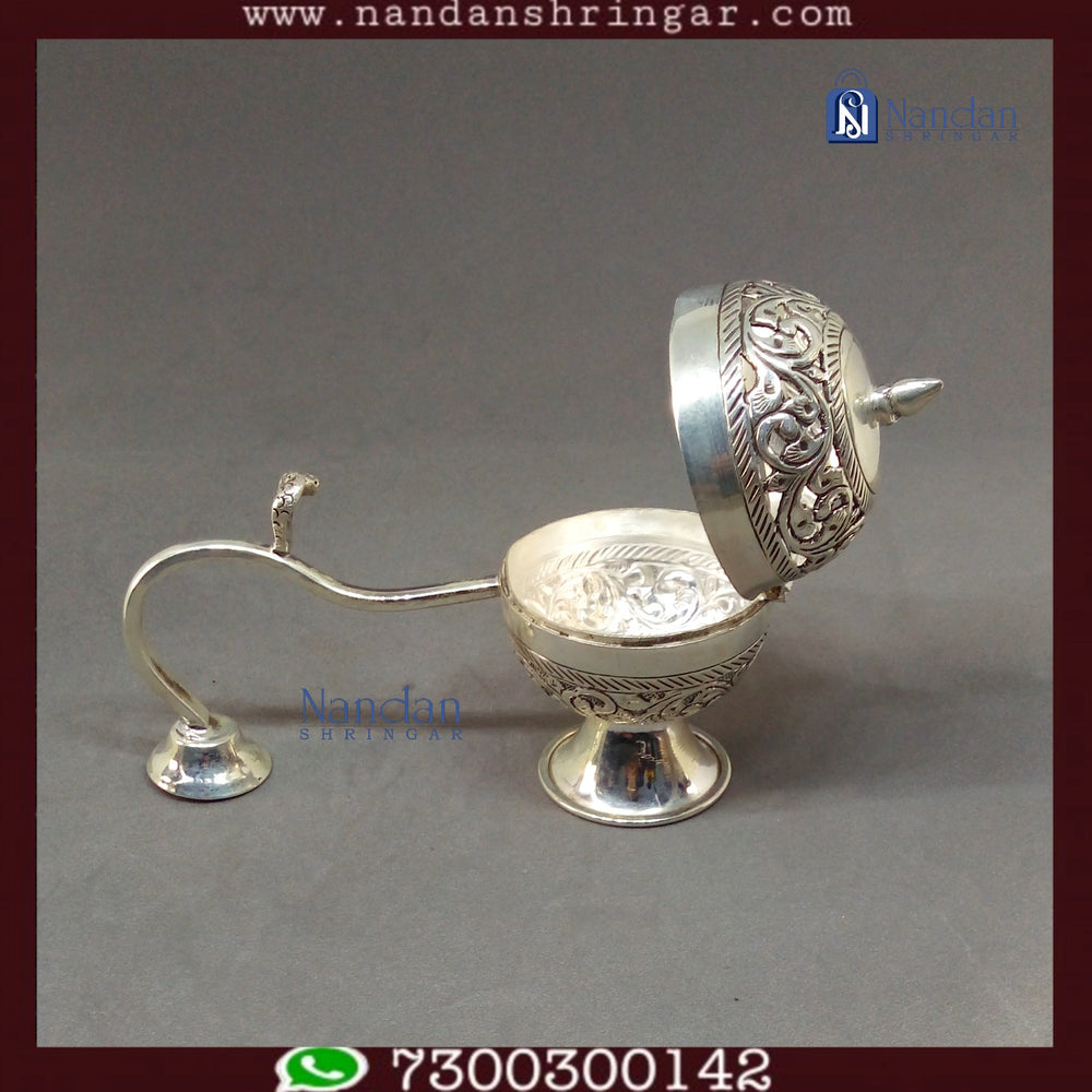 Fine silver Special Dhoop Aarti from Utsav Arts, showcasing intricate design and craftsmanship in a decorative setting.
