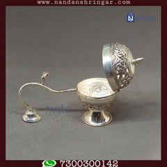 Fine silver Special Dhoop Aarti from Utsav Arts, showcasing intricate design and craftsmanship in a decorative setting.