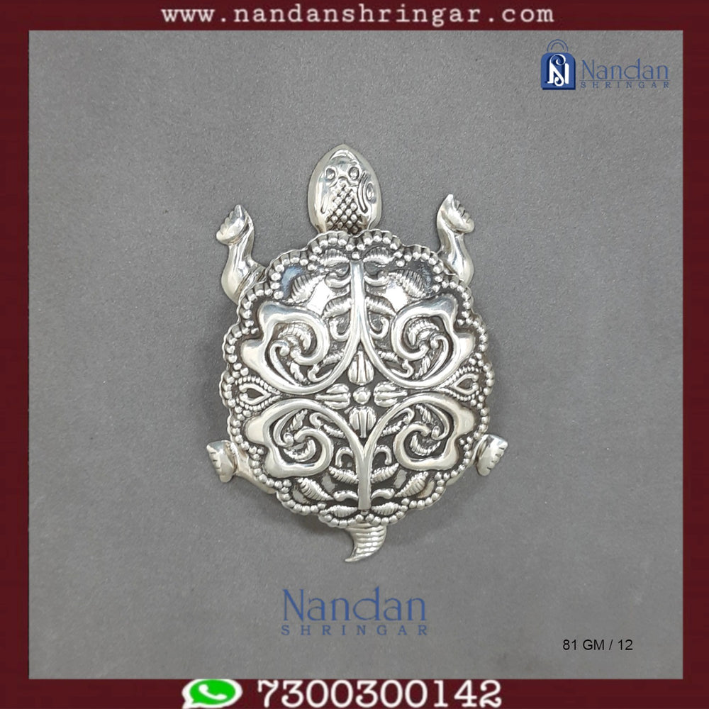 Fine silver tortoise figurine by Utsav Arts, detailed craftsmanship and smooth finish in a natural pose.
