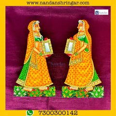 Gopi Darpan Pair in vibrant orange by Nandanshringars, showcasing intricate design elements and craftsmanship.
